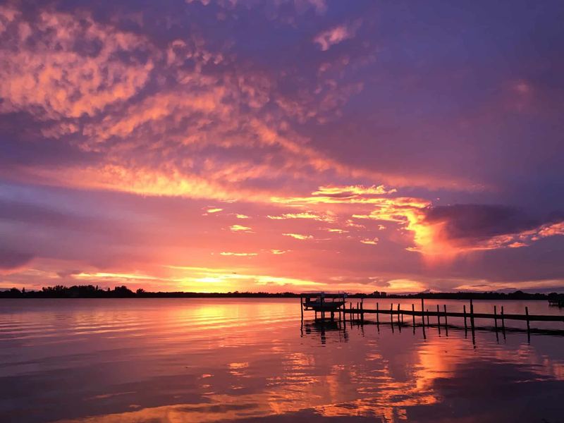 Sunset over a Sarasota dock after an evening fishing charter
